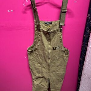J. Peterman Company olive green cotton twill bib overalls.